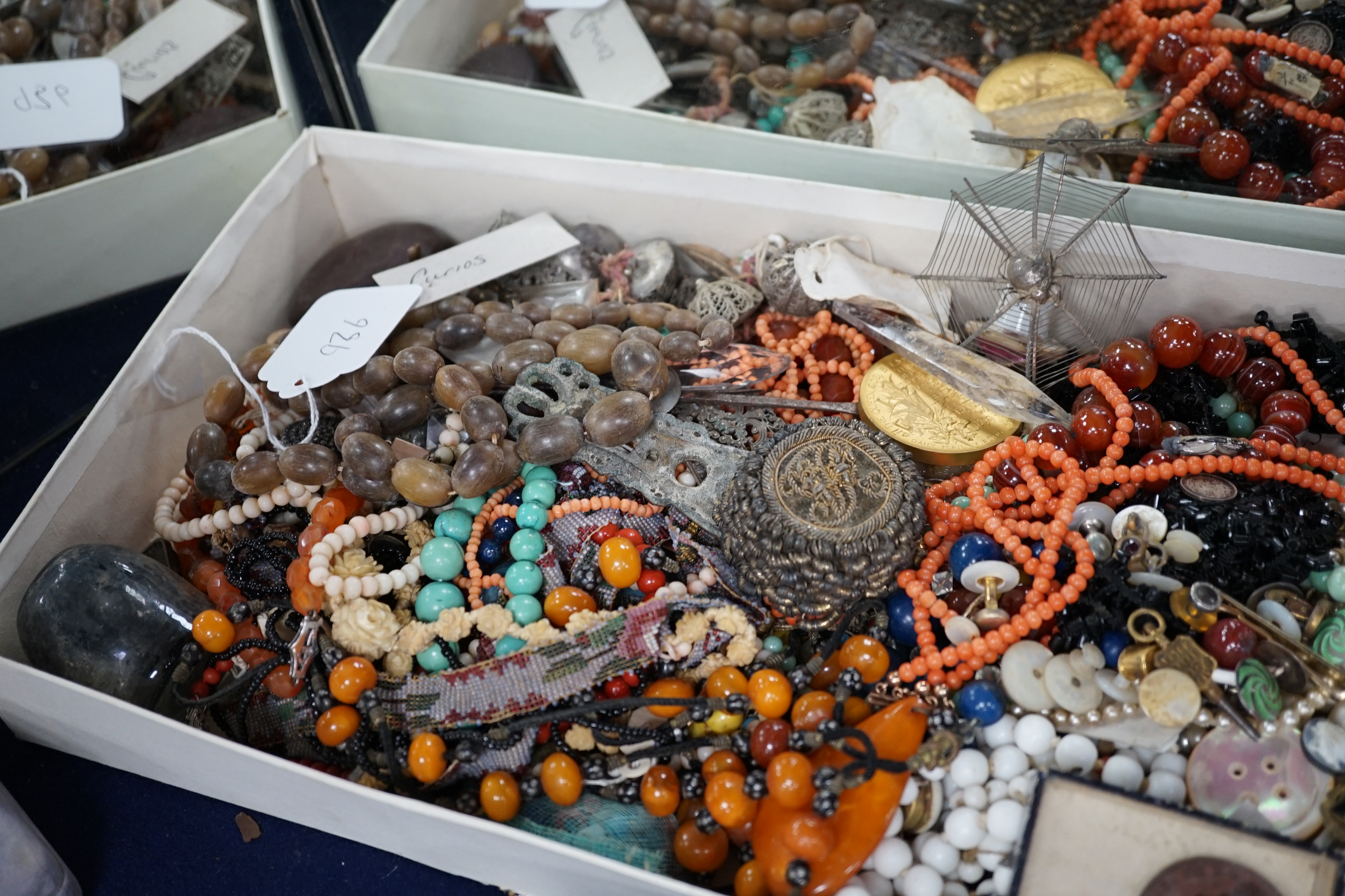 A mixed quantity of assorted jewellery and other items including carnelian agate, coral and amber necklaces, hair ornament, shells, spectacles, etc. Condition - poor to fair